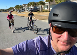self-portrait of me cycling with family